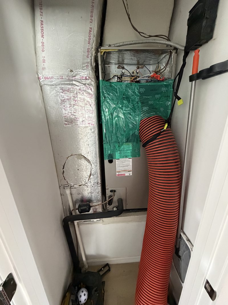 Collection hose connected at the air handler for negative pressure