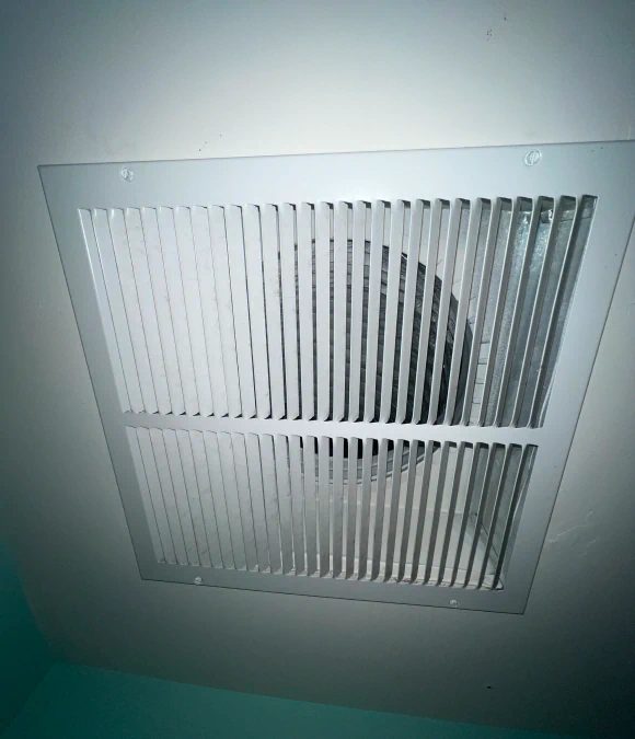 Ceiling exhaust grille in a multi-family unit
