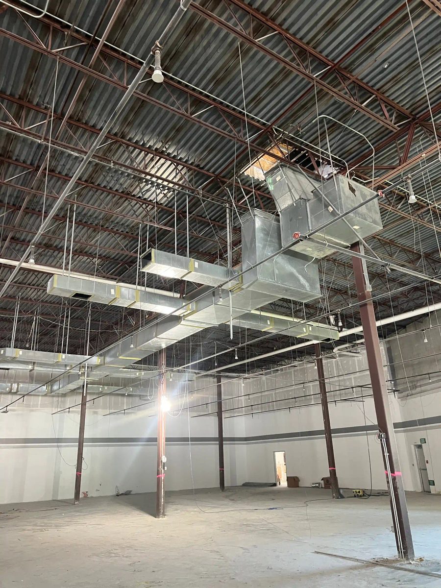Exposed duct system in a commercial building during cleaning