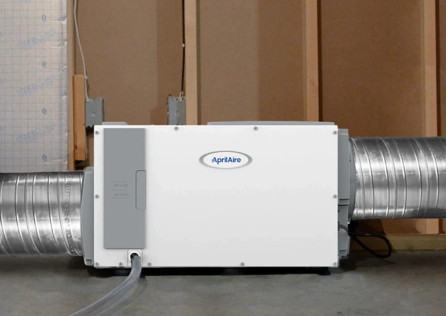Whole-home dehumidifier installed alongside HVAC ductwork